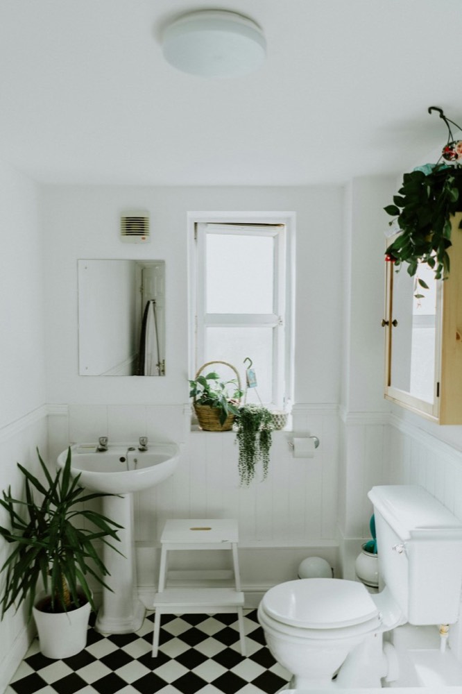 Bright bathroom with chequerboard floor tiles