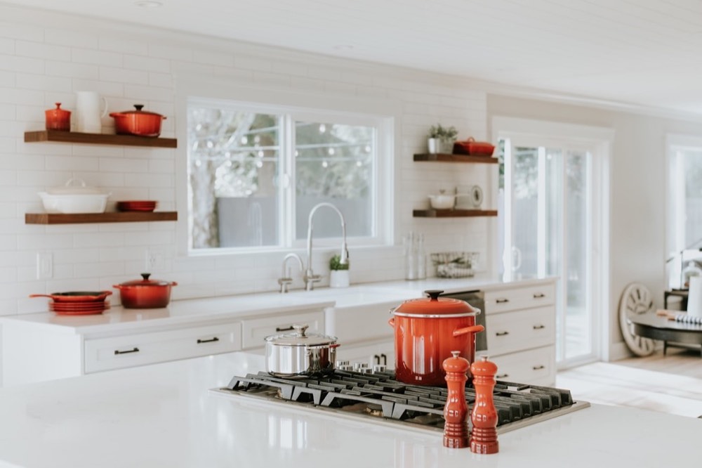 White modular kitchen with open timber shelves